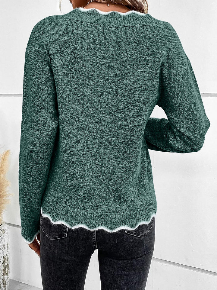 Fabric texture of a soft women's relaxed fit long sleeve top with a distinct notch V-neck.