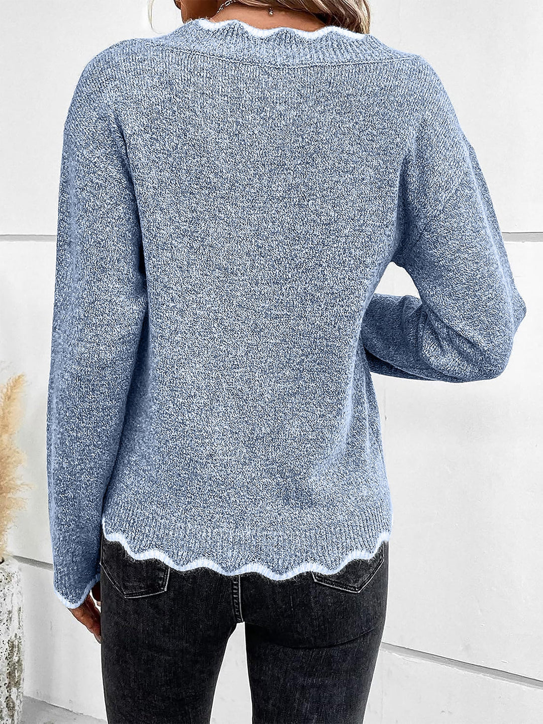 Model wears a comfortable women's notch V-neck long sleeve sweatshirt, perfect for loungewear.