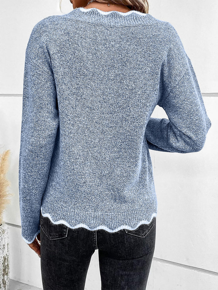 Model wears a comfortable women's notch V-neck long sleeve sweatshirt, perfect for loungewear.