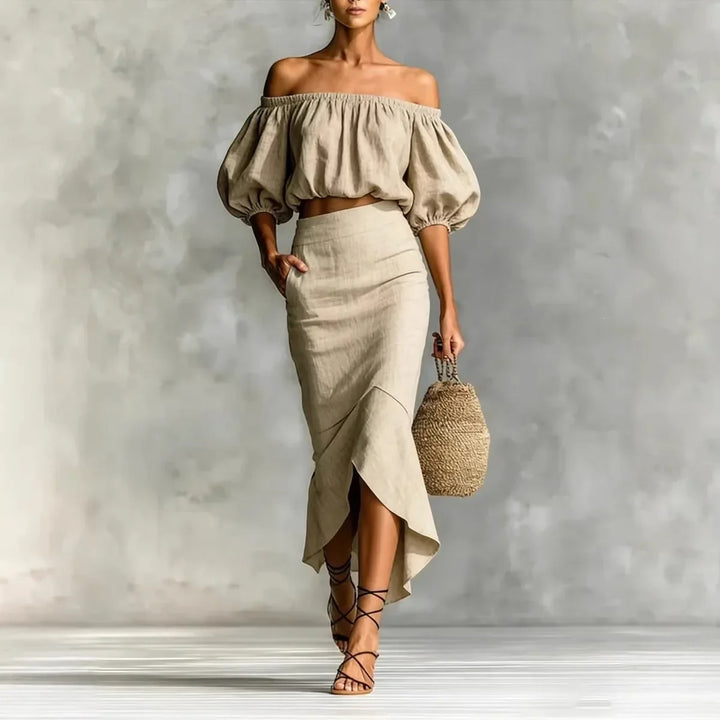 Women's chic off-shoulder crop top & wrap midi skirt set with puff sleeves, perfect for summer or vacation.