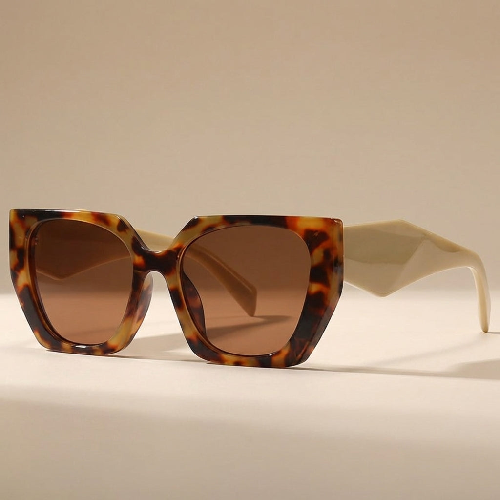 Orange oversized cat eye sunglasses for women, stylish UV400 eyewear accessory.