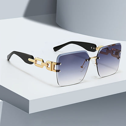 Women's chic rimless sunglasses with gold chain link temples. UV400 protection, fashion accessory.