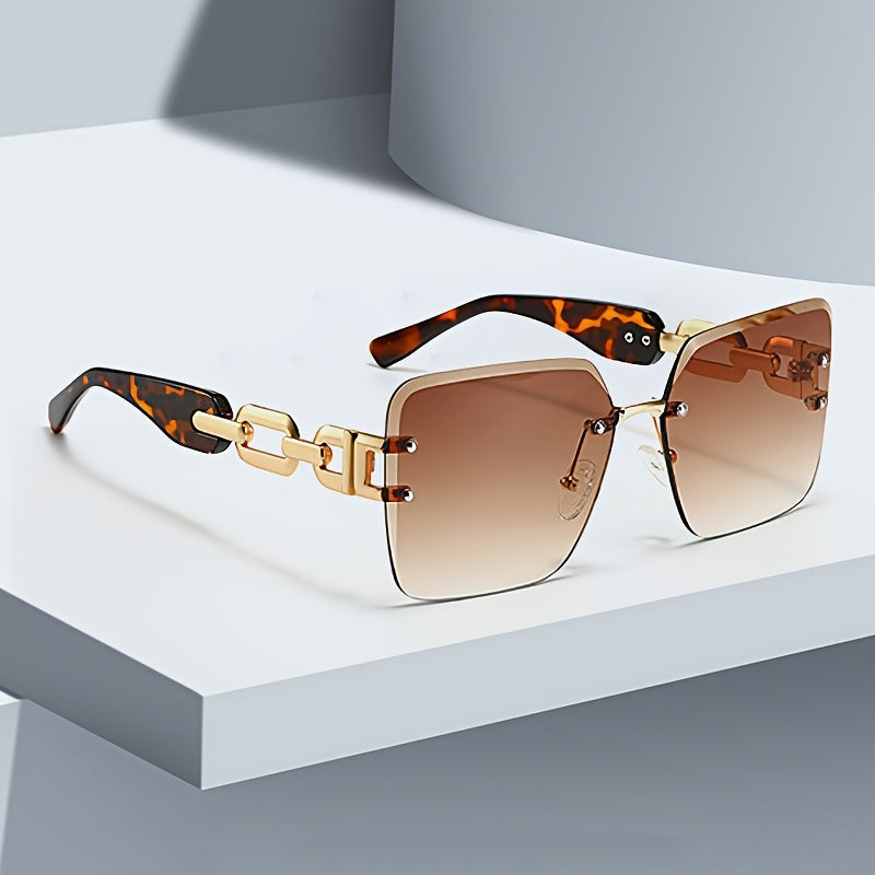Designer women's rimless sunglasses, elegant chain link arms, UV400 lenses, stylish fashion accessory.