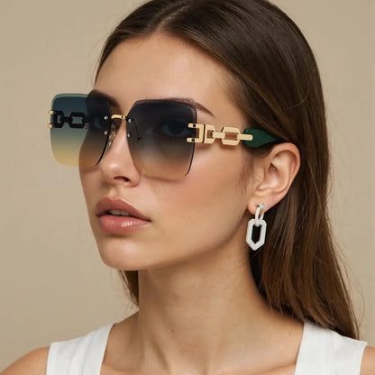 Chic women's rimless square sunglasses, featuring trendy chain link arms, a fashion-forward UV400 accessory.