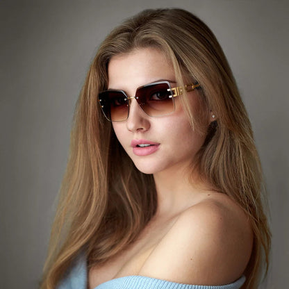 Contemporary women's rimless sunglasses with elegant chain link detail, a chic fashion accessory for UV400.