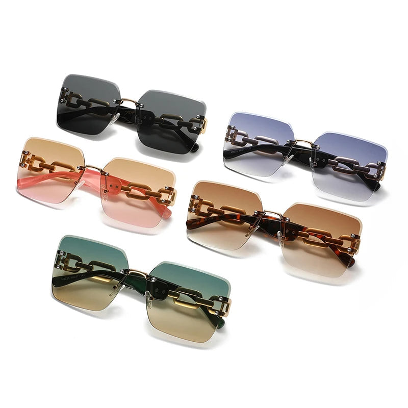 Women's chic rimless sunglasses, gold chain link temples. UV400 fashion accessory.