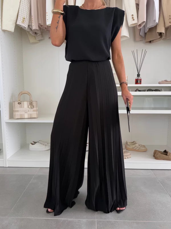 Chic women's relaxed fit sleeveless top & wide leg pants set. Versatile for casual outings or elegant occasions.