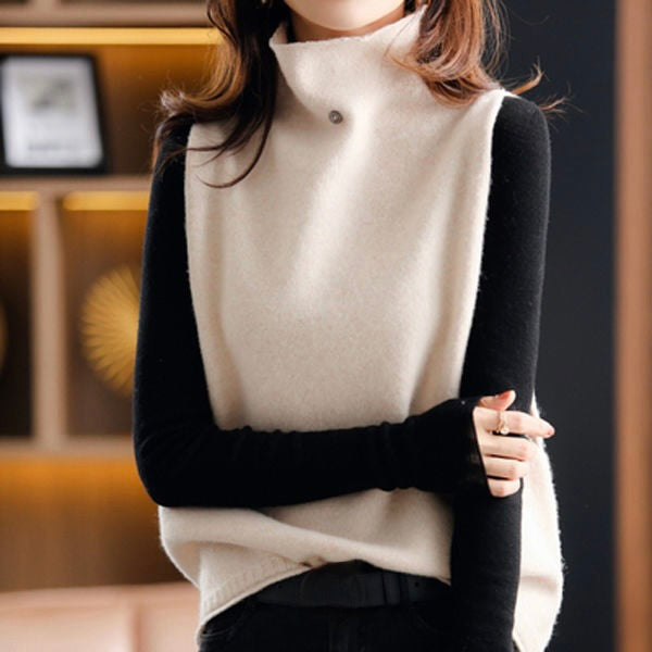Model wearing a stylish women's sleeveless turtleneck vest top. Elegant high neck design, perfect for any season.
