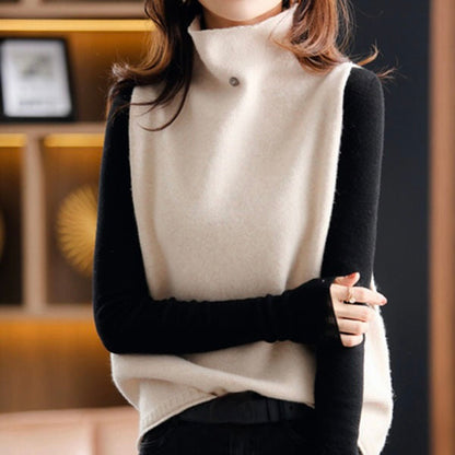 Model wearing a stylish women's sleeveless turtleneck vest top. Elegant high neck design, perfect for any season.