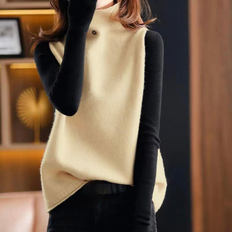 Modern women's chic sleeveless turtleneck vest top. A trendy high neck layering piece for sophisticated style.