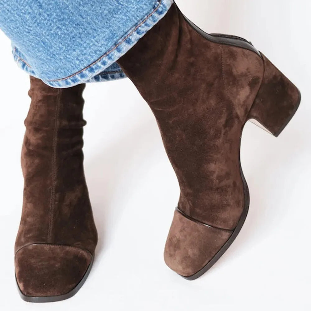 Women's chic square toe heeled boots with block heel, perfect for modern style.