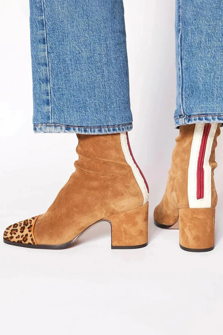 Chic women's square toe heeled boots, block heel, offering modern comfort & stylish versatility.