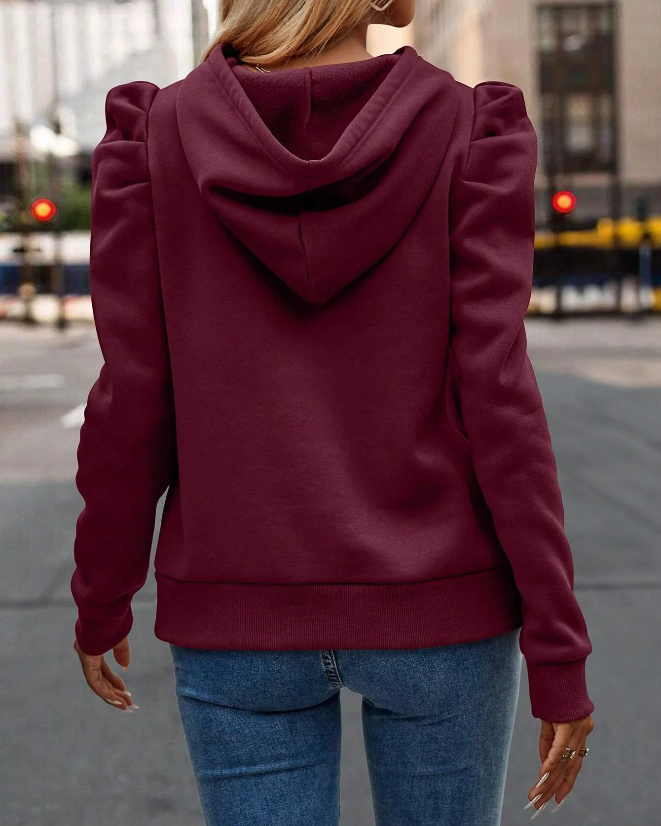 Chic women's hooded sweatshirt with fashionable stacked sleeves, great for modern everyday style.