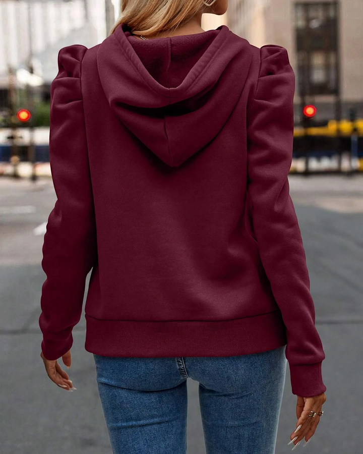 Chic women's hooded sweatshirt with fashionable stacked sleeves, great for modern everyday style.