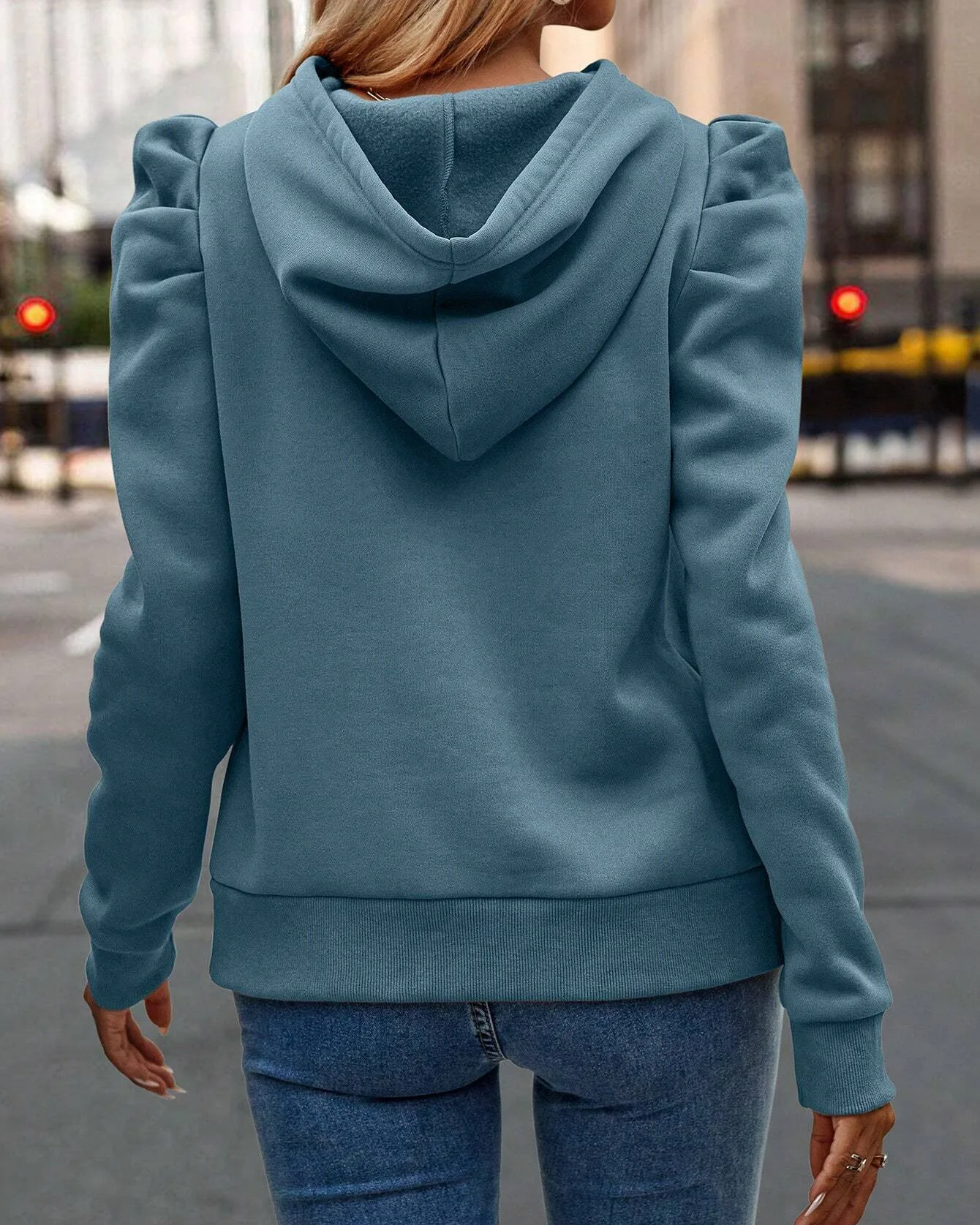 Stylish women's stacked sleeve hoodie with ruched shoulders, a chic sweatshirt for casual everyday wear.