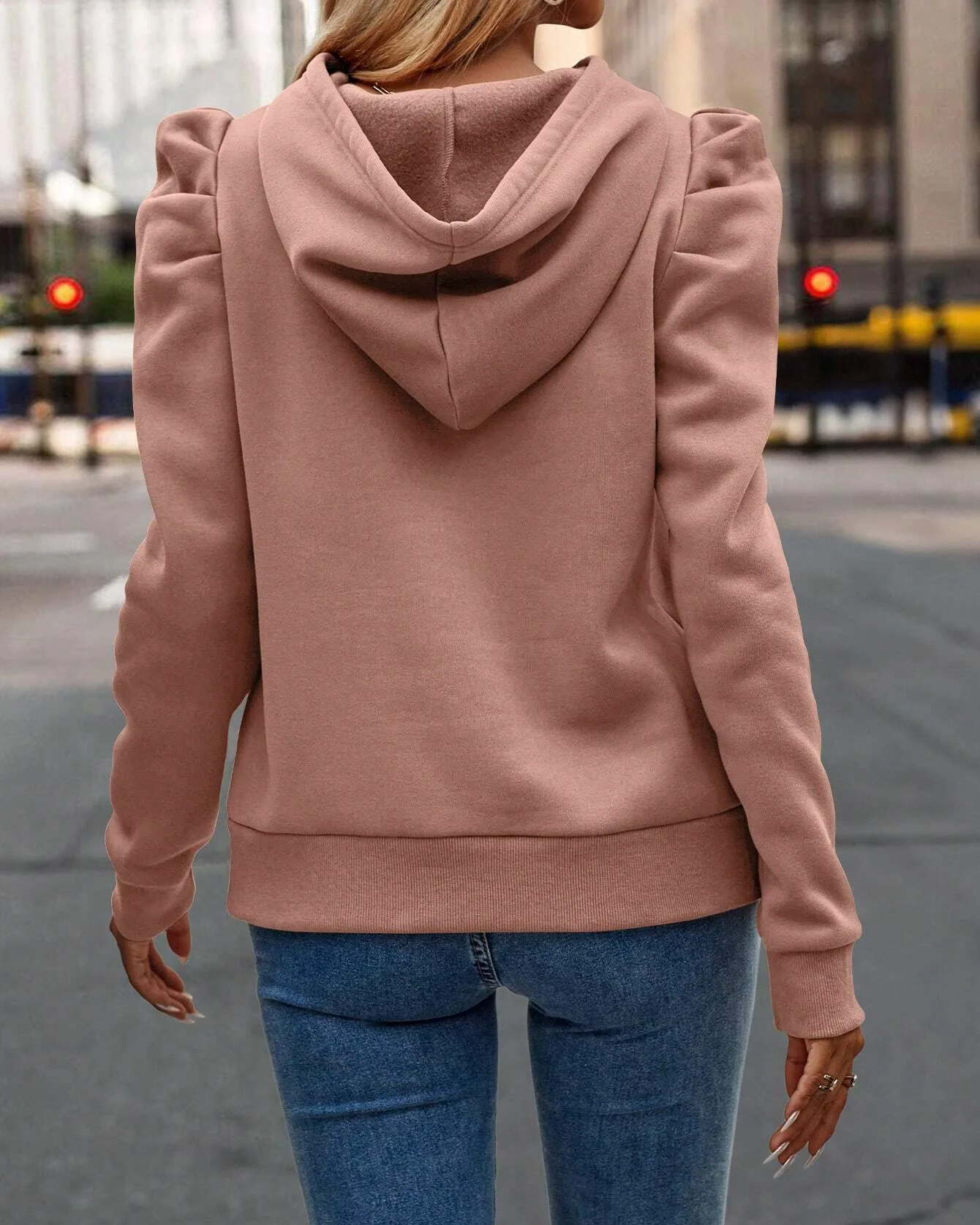 Modern women's stacked sleeve sweatshirt with ruched shoulders, ideal for casual wear.