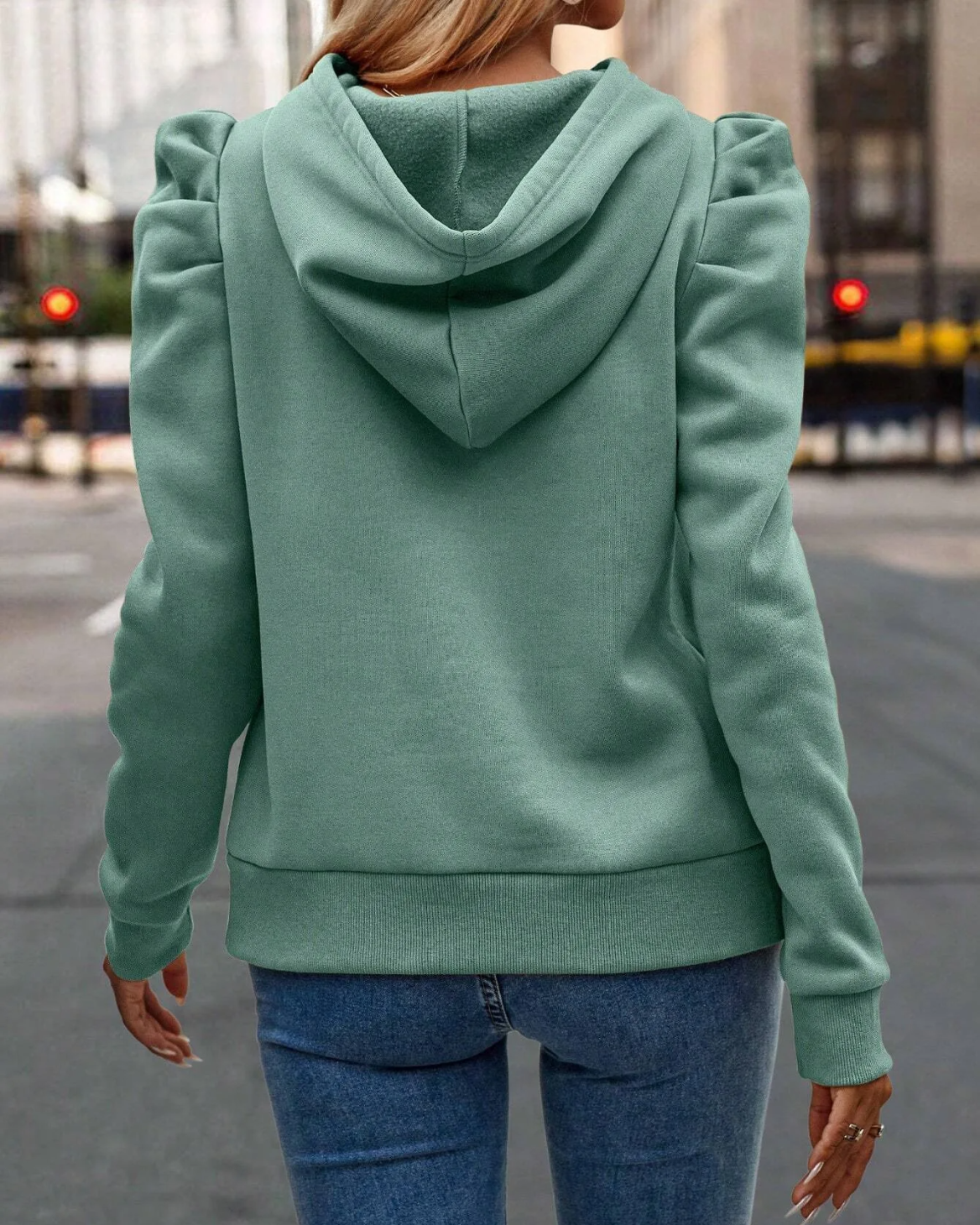 Stylish women's hoodie with unique stacked sleeves, a modern layering piece for any outfit.