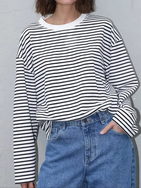 Versatile women's striped bell sleeve sweater. Fashionable pullover with an elegant design, ideal for any outfit.