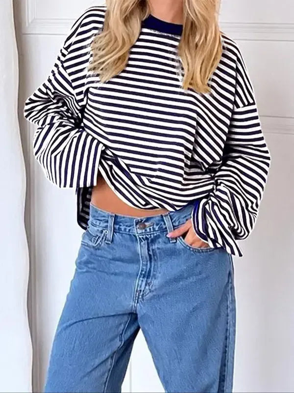 Stylish women's striped bell sleeve pullover. Elegant long sleeve top, perfect for a chic and versatile look.
