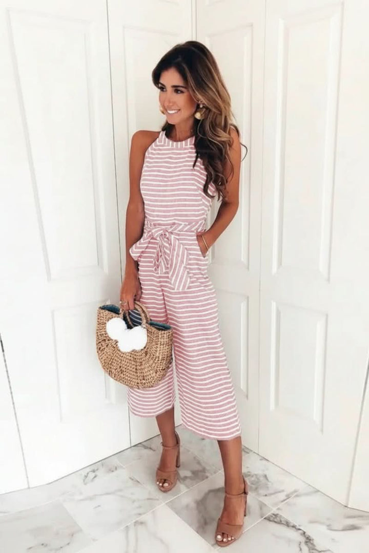 Women's chic striped halter jumpsuit with a stylish belt, perfect for versatile summer fashion and day-to-night wear.