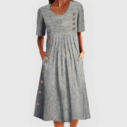 Comfortable women's striped midi dress featuring 3/4 sleeves, ideal as a casual summer dress.