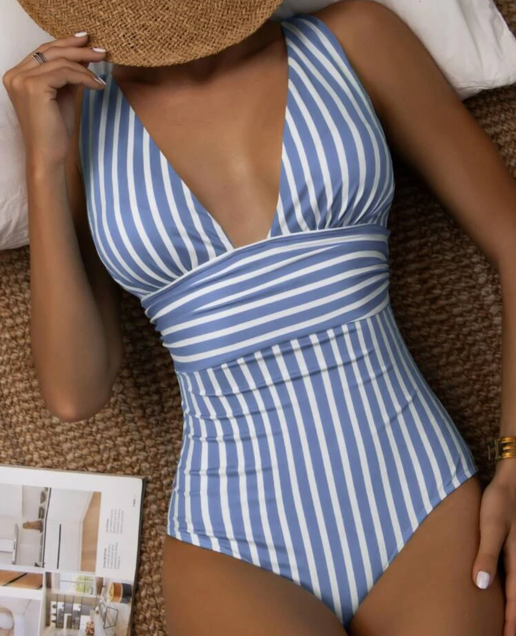 Close-up of a women's striped one-piece swimsuit, highlighting fabric and design.