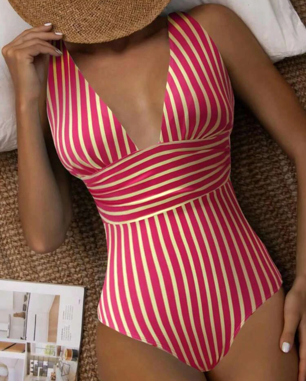 Women's striped one-piece swimsuit on a model, showcasing stylish beachwear.