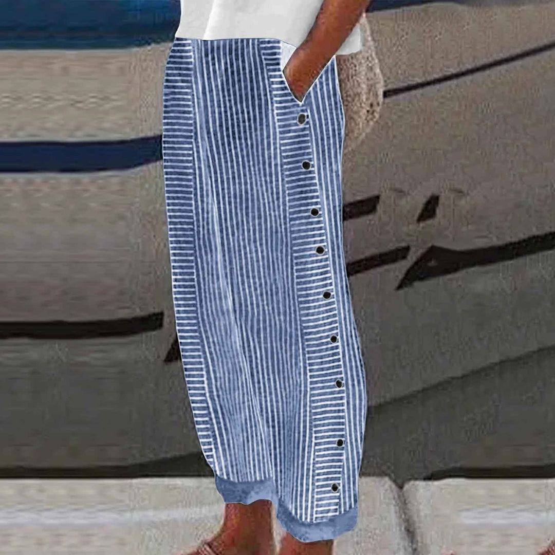 Comfortable women's striped pants with unique button accents, ideal for stylish everyday fashion bottoms.