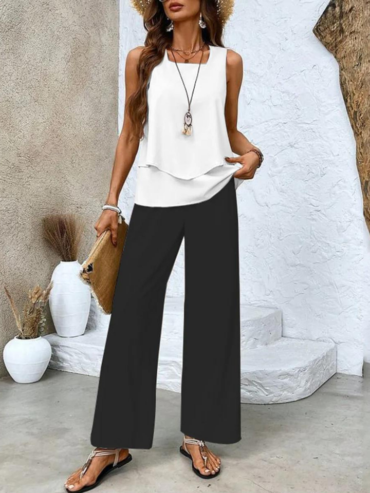 Women's stylish two-piece set for summer. Flowy top & comfortable wide-leg pants. Casual chic elegance.