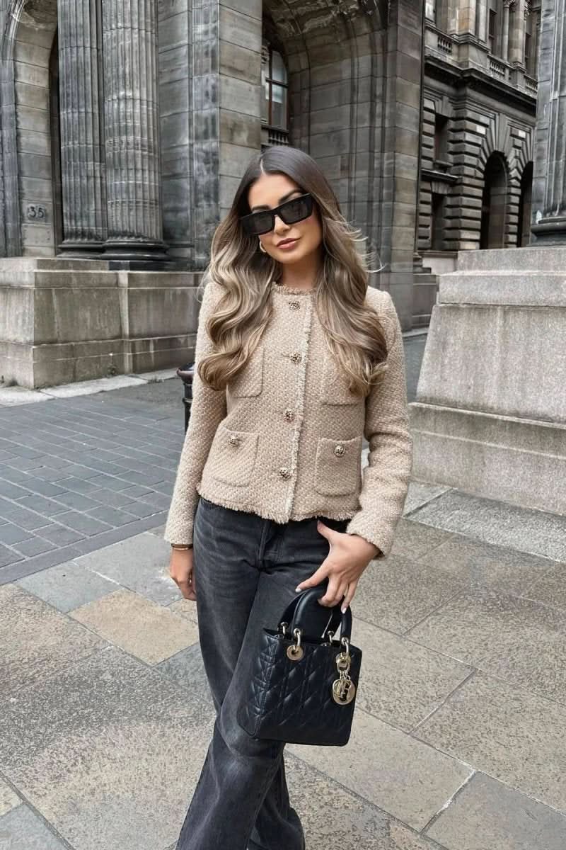 Stylish women's cropped tailored blazer, offering a chic look for business casual or formal events.