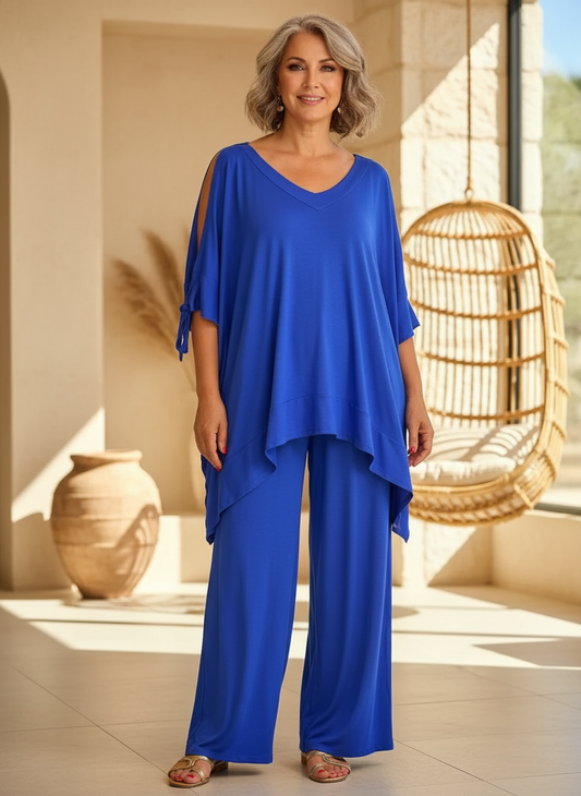Women's chic two-piece lounge set with relaxed fit wide-leg pants, perfect for casual summer wear and travel.