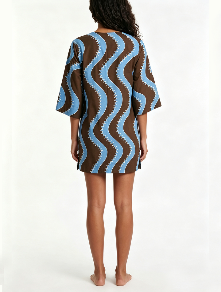 Elegant women's wave print mini dress. Collared, button-front, & elbow sleeves for a chic, casual summer look.