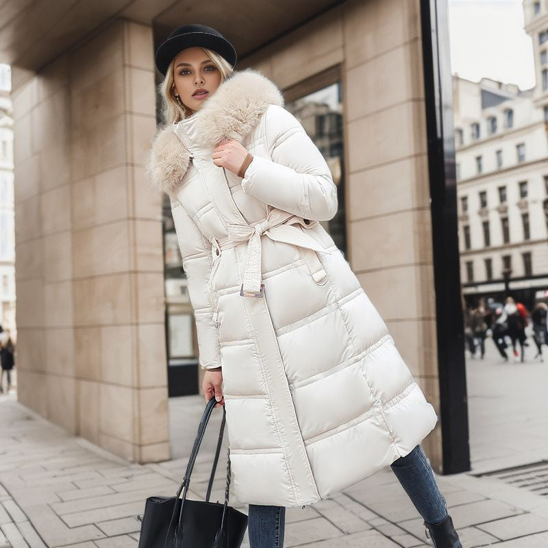 Cozy women's chic winter jacket, offering warmth and style with a detachable hood for versatility.