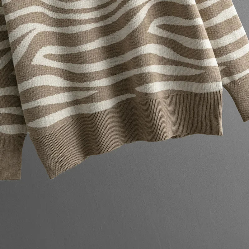 Close-up of a women's cozy zebra print knit sweater. Stylish and comfortable loungewear top.