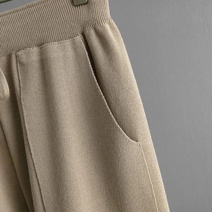 Detail shot: Soft, plush knit fabric with a distinctive zebra print, ideal for cozy women's loungewear.