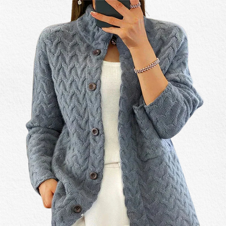 Soft long sleeve women's chunky cable knit cardigan featuring elegant button-front design, ideal for layering.