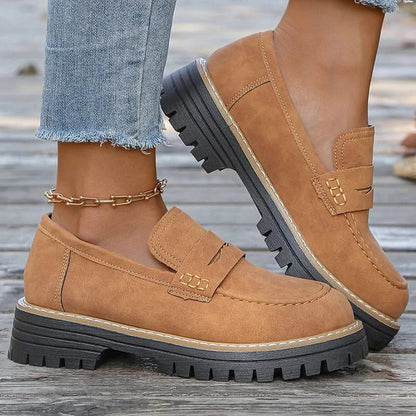 Women's chunky platform loafers, stylish black slip-on fashion footwear for everyday comfort.