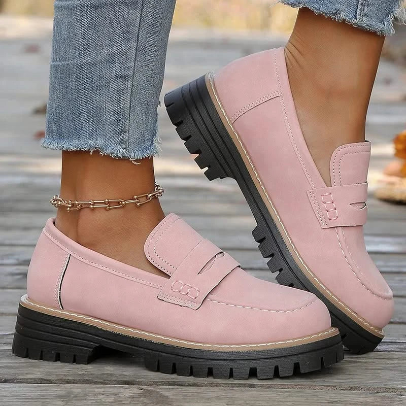 Black women's chunky platform loafers, a versatile slip-on shoe for casual and dressy looks.