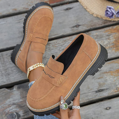 Stylish women's black chunky platform loafers, perfect slip-on shoes for fashion-forward looks.
