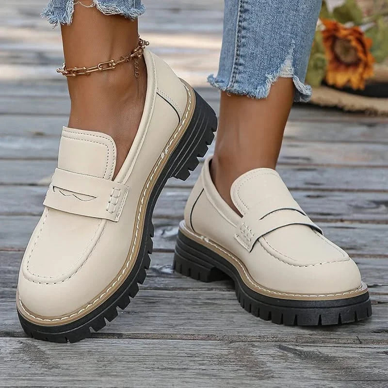 Fashionable women's slip-on loafers with a chunky platform, ideal for trendy footwear.