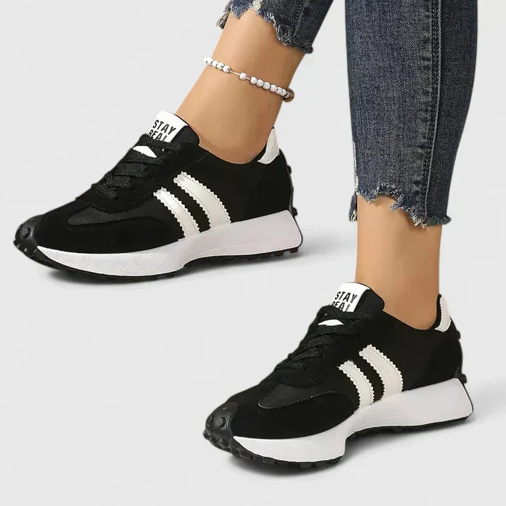 Women's chunky sole running shoes for gym workouts. Comfortable lace-up athletic trainers for sporty fitness wear.