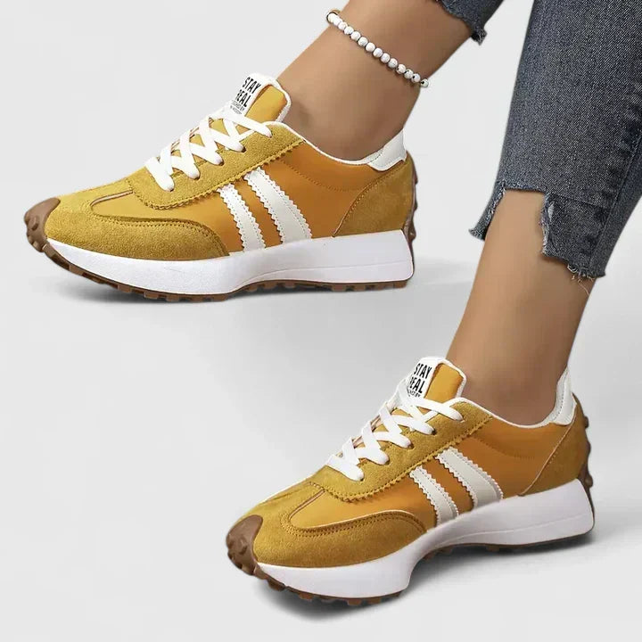 Sporty women's chunky sole gym sneakers, ideal for running & fitness workouts. Comfortable lace-up athletic footwear.