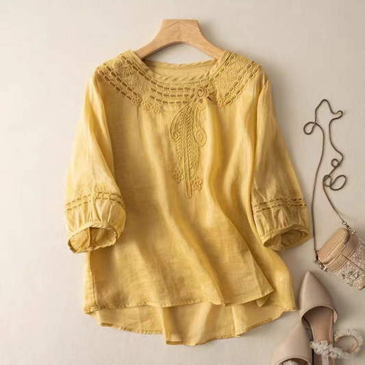 Women's Claire embroidered flowy blouse in a relaxed fit, perfect for elegant casual spring & summer wear.