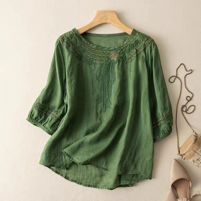 Black Claire embroidered flowy blouse, a versatile women's top with relaxed fit, suitable for casual or elegant looks.