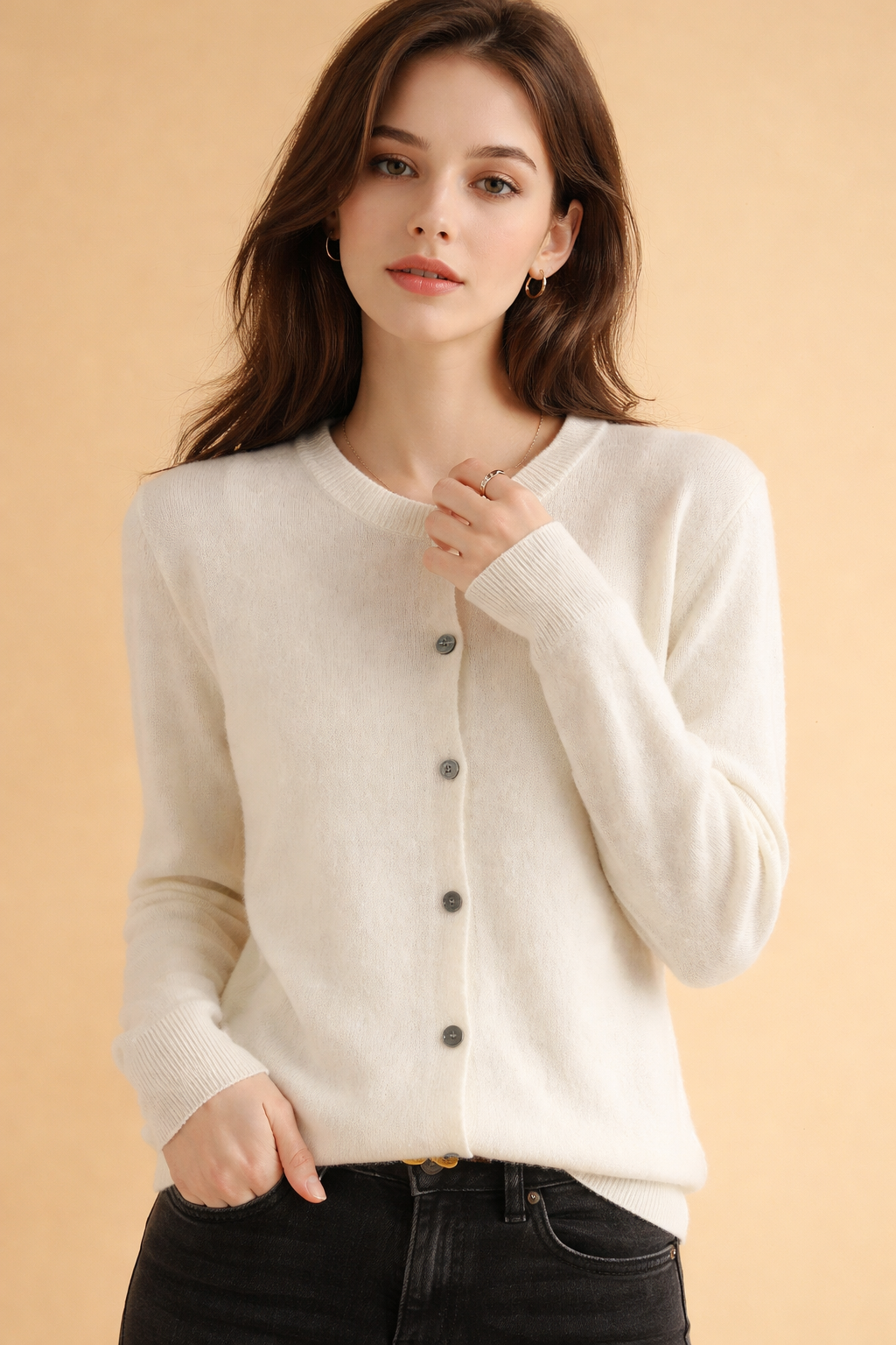 Comfortable women's knit cardigan featuring a round neck & classic button-front design. Ideal for everyday fashion.