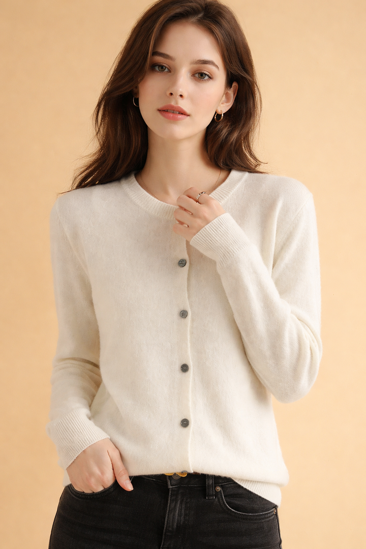 Comfortable women's knit cardigan featuring a round neck & classic button-front design. Ideal for everyday fashion.