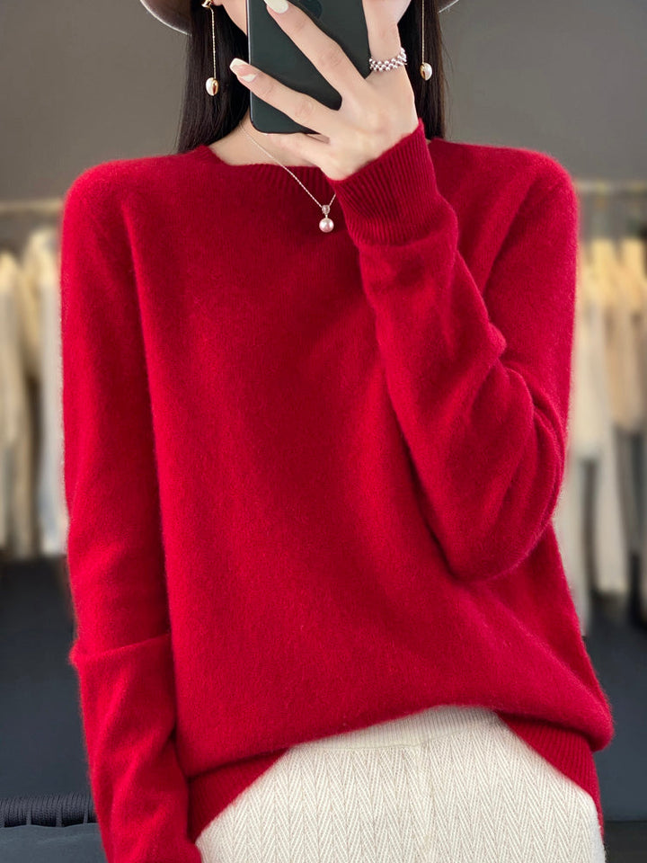 Front view: classic women's round neck pullover sweater, long sleeve, elegant everyday look.