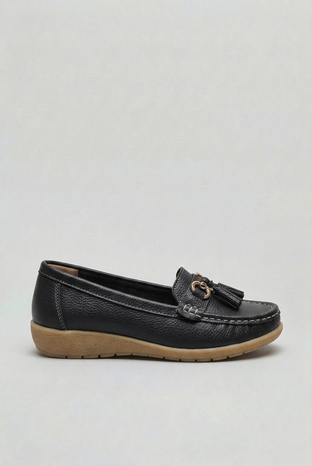 Stylish women's cushioned loafers worn for an elegant, yet comfortable, everyday fashion look.