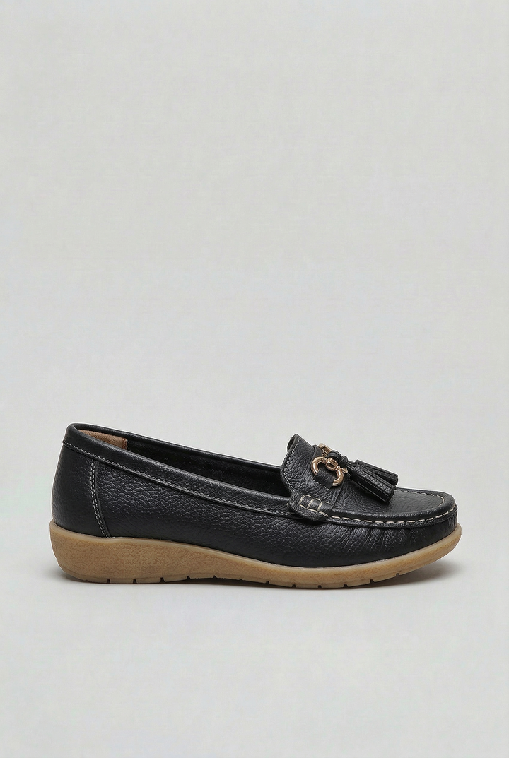 Stylish women's cushioned loafers worn for an elegant, yet comfortable, everyday fashion look.
