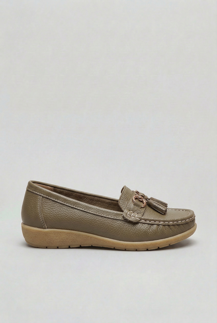 Top-down view of classic women's slip-on loafers, emphasizing their timeless everyday style.